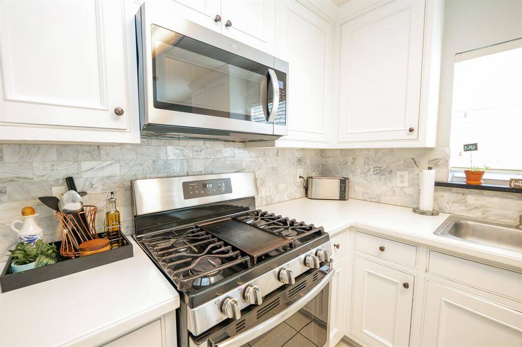 The home features a sleek, stainless steel stove that combines modern style with everyday functionality.