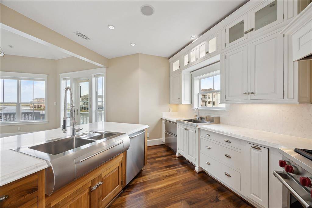 Kitchen provides 3 custom stainless steel sinks & two additional SubZero undercounter refrigeration drawers that are separate from the main refrigerator