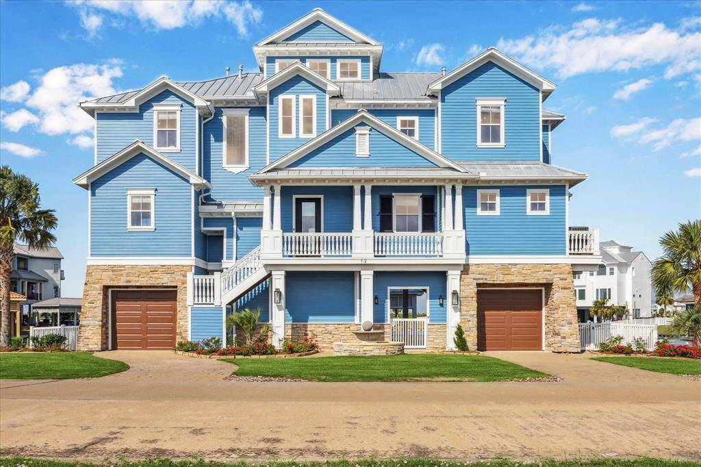 Experience refined coastal luxury at this chic bayside retreat, where timeless design meets handcrafted elegance. Featuring handmade gas lanterns, a stone-clad exterior, custom shutters, and hand-turned balusters and railings, this Coastal Classic is rich in detail and sophistication—offering exquisite features both inside and out
