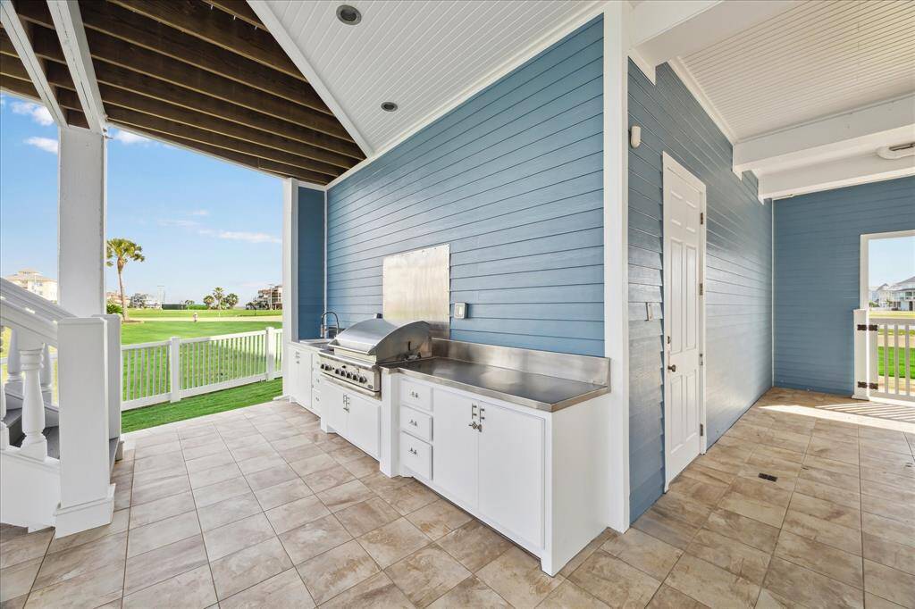 The dockside outdoor kitchen is ideal for grilling your fresh catch or cooking outdoors —bringing together waterfront living and effortless entertainment