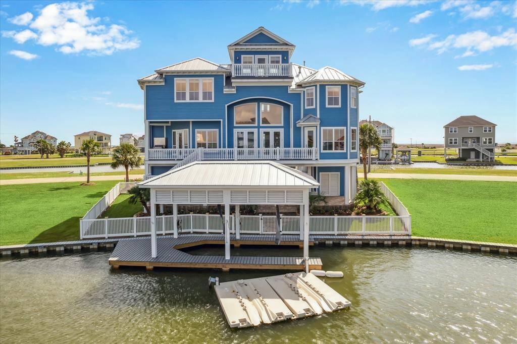 Multiple balconies including a top level balcony to view all of Harborwalk & West Galveston Bay. Plenty of dockside outdoor living space for your family & friends. Boathouse provides a lift and sun deck with swim ladder. The double homesite offers room to build a pool or many other possibilities as well as an additional boathouse if desired