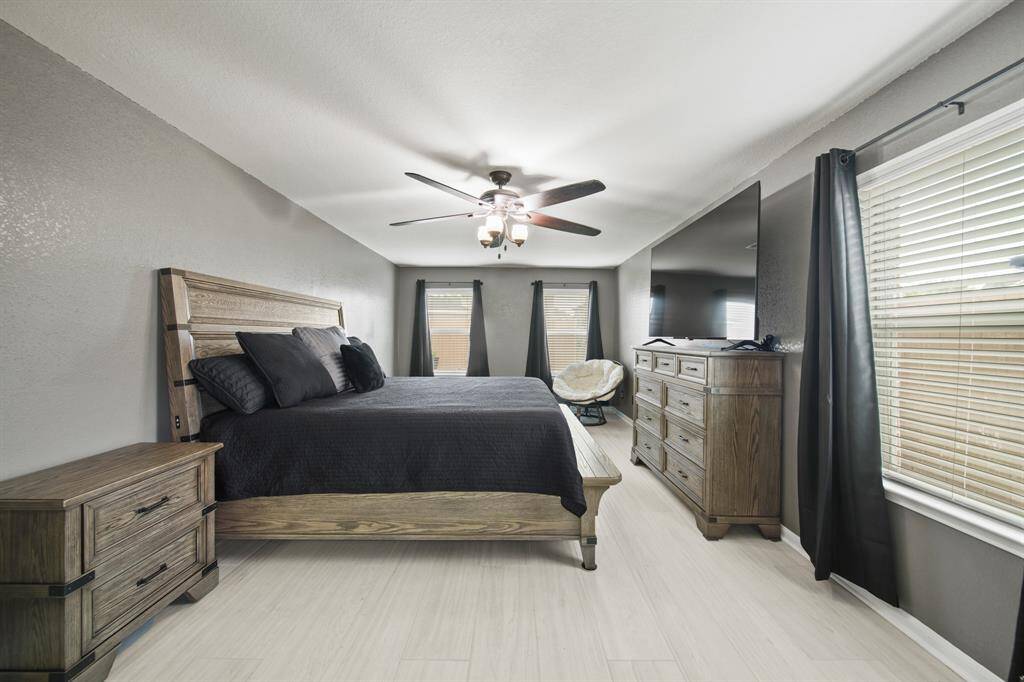 Spacious, the private owner's suite sits on the back of the home and is separate from the secondary bedrooms.