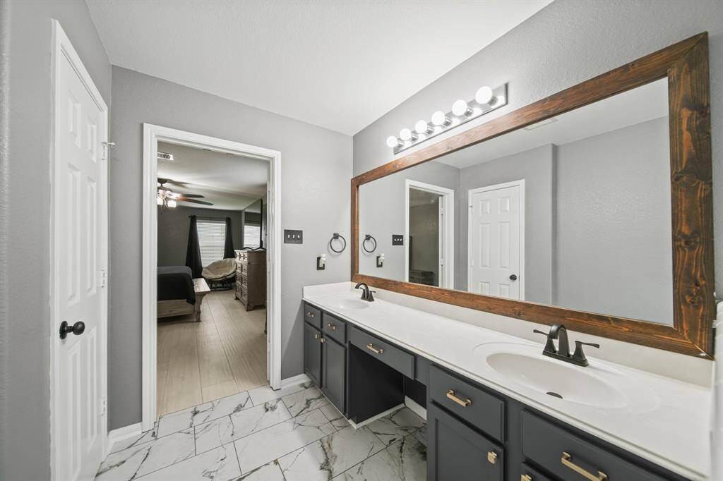 Additional features include a linen storage closet, private water closet, a 14' x 11' walk-in wardrobe storage closet and tile flooring. Toilets in both of the home's bathrooms were replaced in 2024.