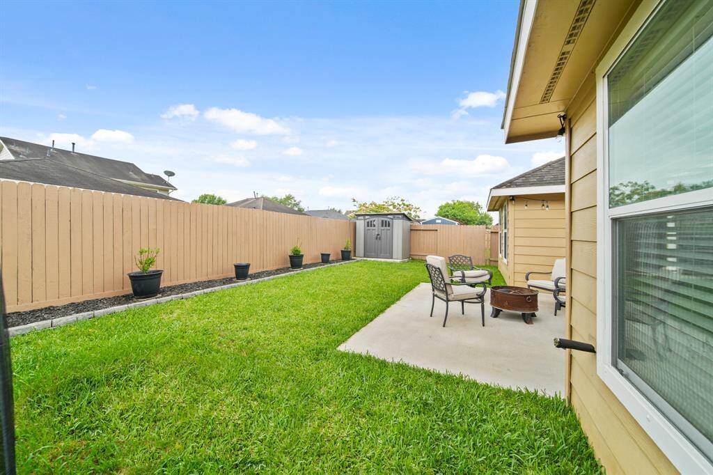 This beautiful backyard is fully fenced with new fence pickets installed in 2024.