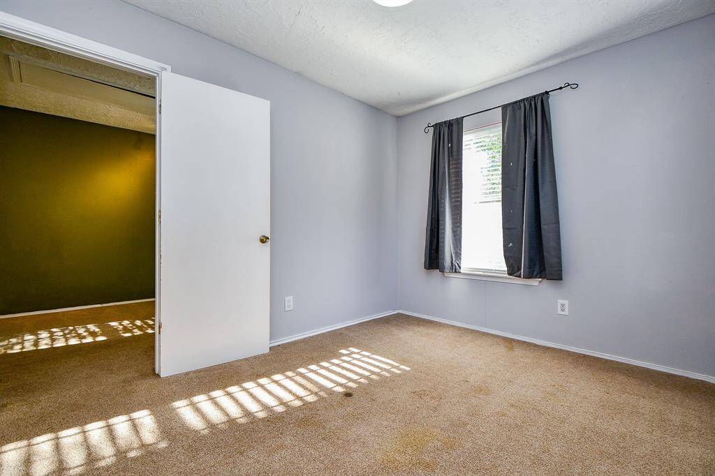 Third bedroom with natural light and closet space.