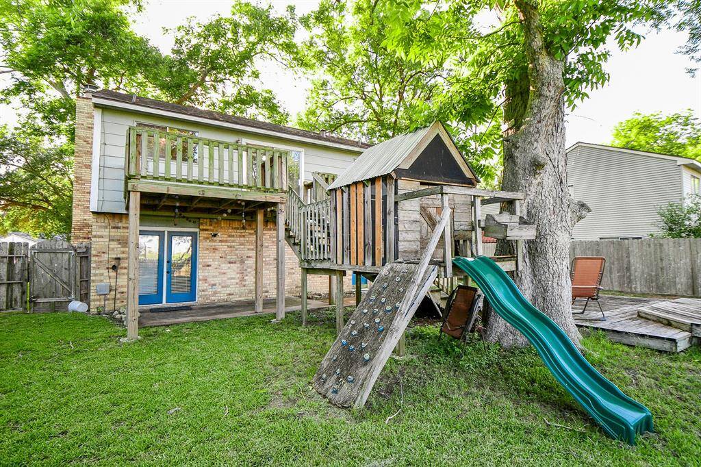 The playground stays with plenty of open, lush space in the backyard.