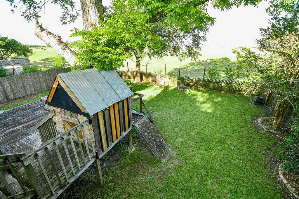 Overview of spacious backyard with no rear neighbors.