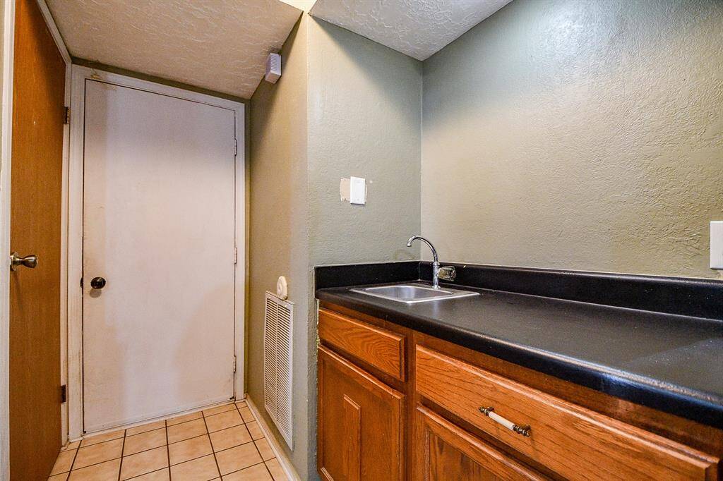 Entertaining? A Wet bar with storage and garage access.