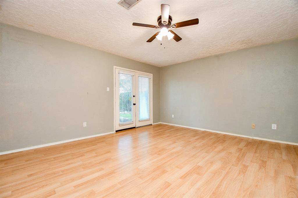 Right off the living area is the large primary bedroom on the first floor.