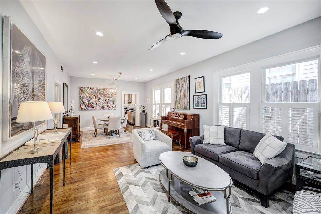 Once inside you are greeted by an open living/dining floorplan with hardwood floors, nice natural light and high ceilings.