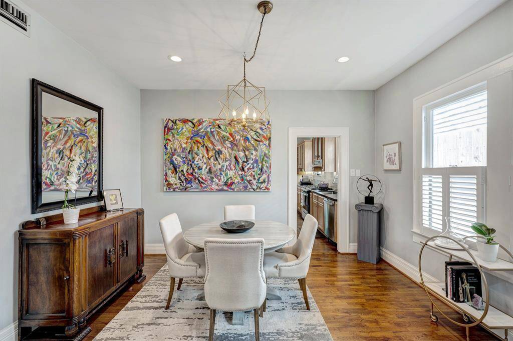 Elegant dining room is highlighted by a stunning chandelier...entertain friends and family in style!