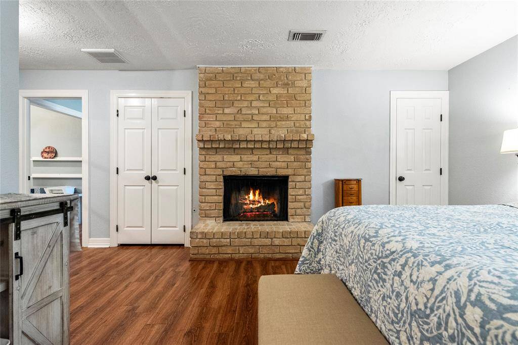 The primary boasts a 2nd fireplace and private bathroom.