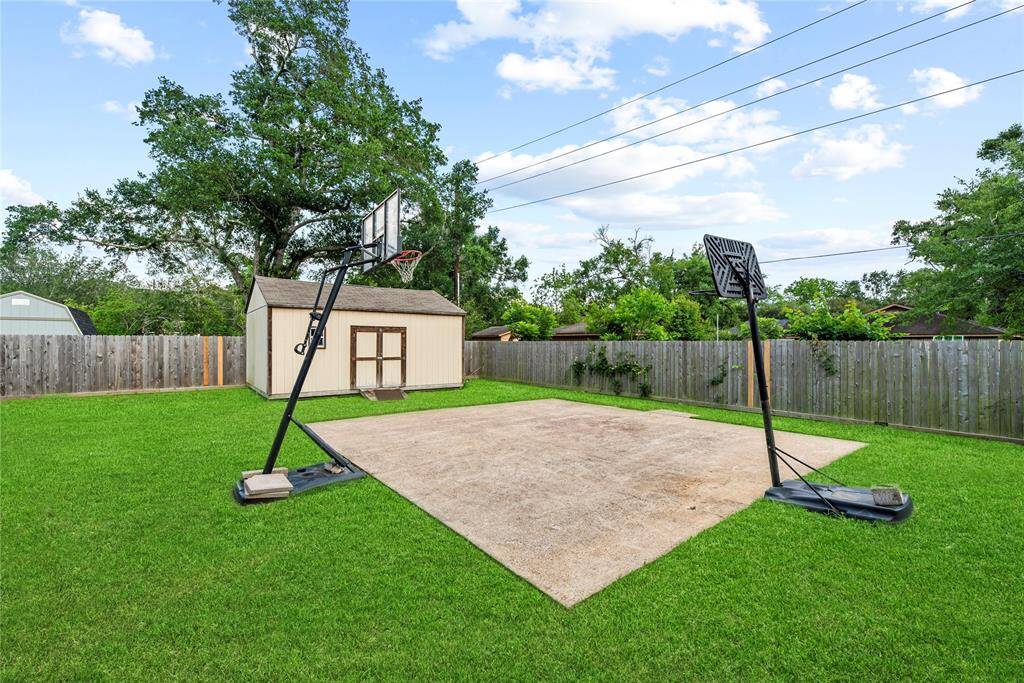 Second storage shed and a basketball area.