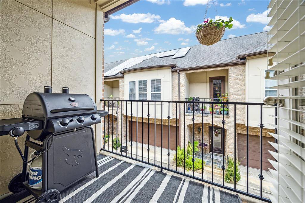 This covered balcony offers a perfect outdoor retreat, complete with elegant wrought iron railing for a touch of classic charm. It’s an ideal space to relax, unwind, or enjoy morning coffee while taking in the fresh air. The covered design provides shade and comfort year-round.