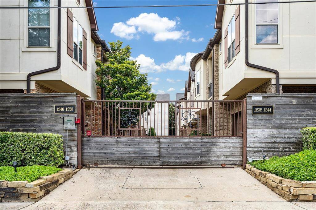 A welcoming entrance to the community, featuring secure gated access that provides both privacy and peace of mind. This well-maintained entry sets the tone for the comfort and safety found throughout the neighborhood.