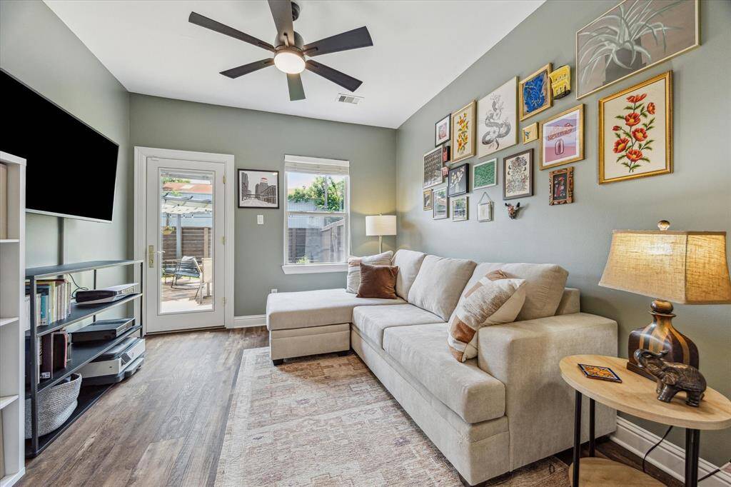 This versatile study or secondary bedroom features elegant French doors at the entryway, leading to the private back patio. Inside, luxury vinyl plank flooring flows throughout the bedroom and closet.