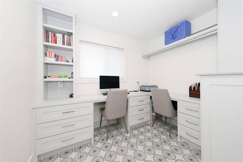 More than just a utility room — this versatile space features built-ins that can easily transform into a home office or kids' workspace