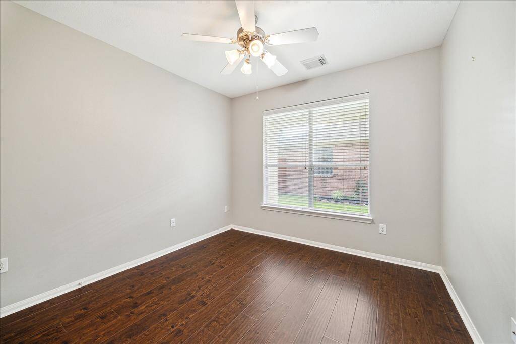 Primary Bedroom faces the back yard, and is filled with sumptuous thick pile carpet.