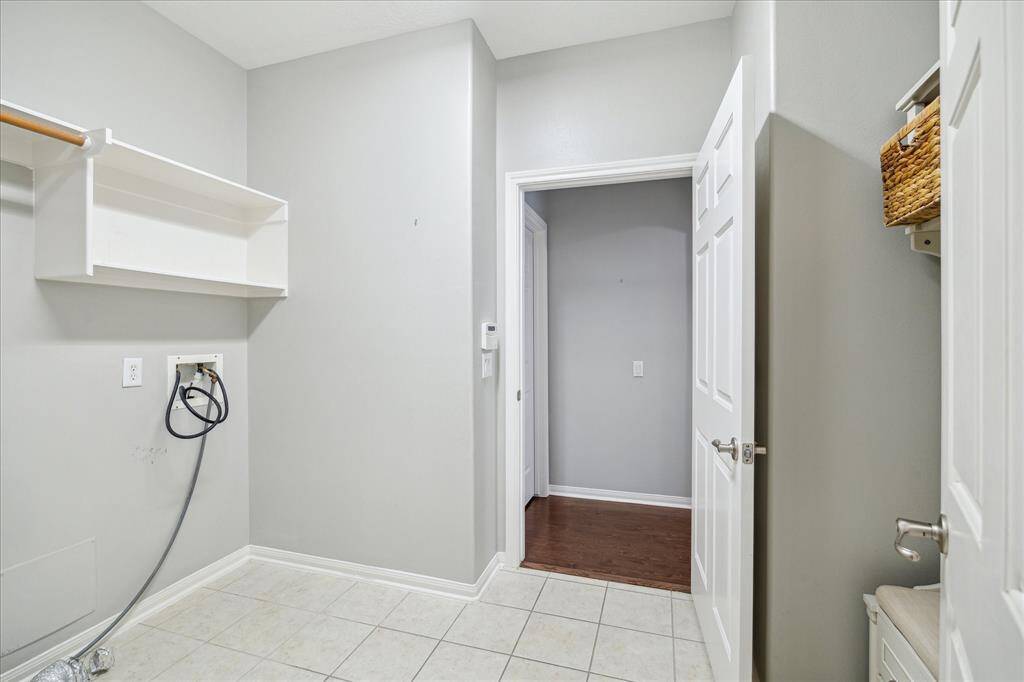 Covered back porch is a perfect place to relax in privacy.