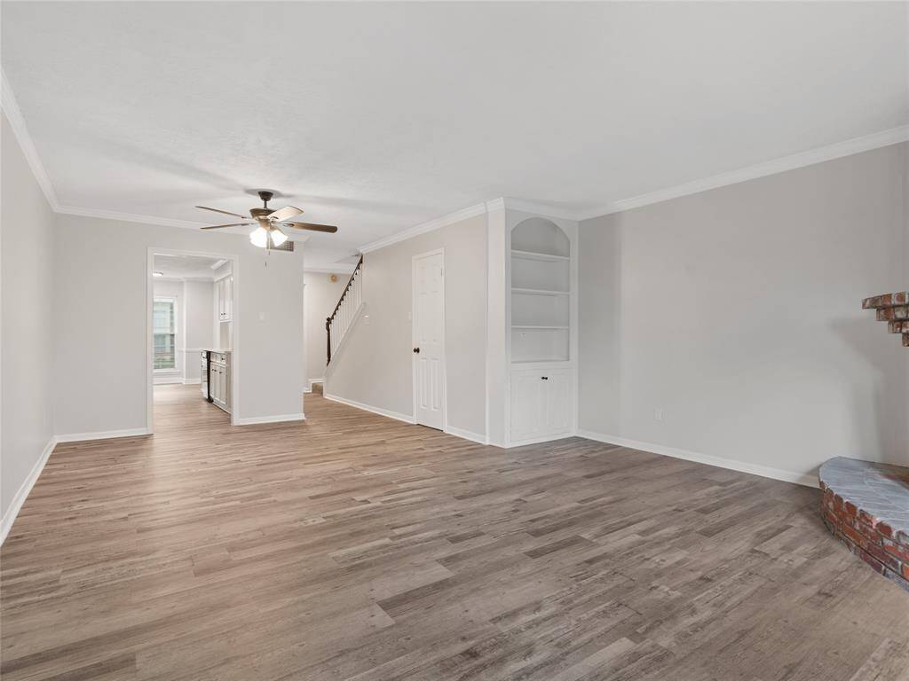 Living room with new LVP and a built in bookshelf