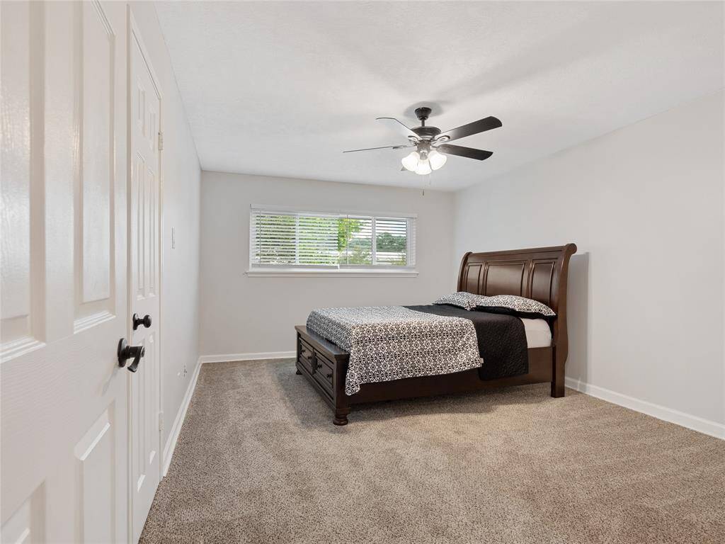 Primary bedroom with new carpet and trim