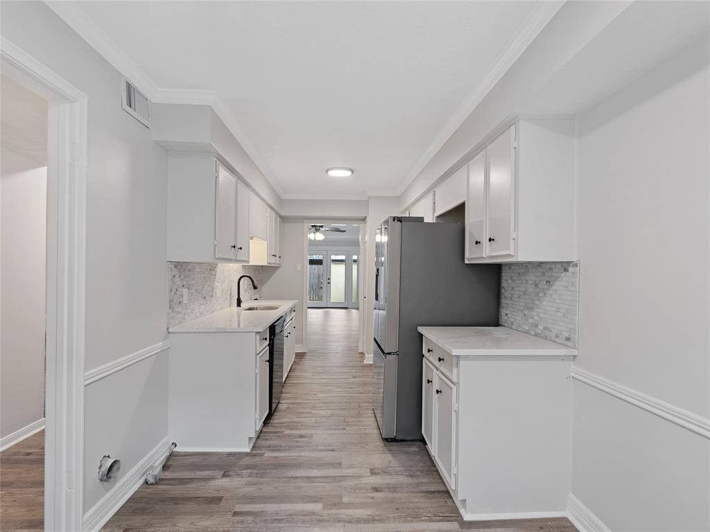 Quarts countertops, farm-style sink, new backsplash and new hardware!