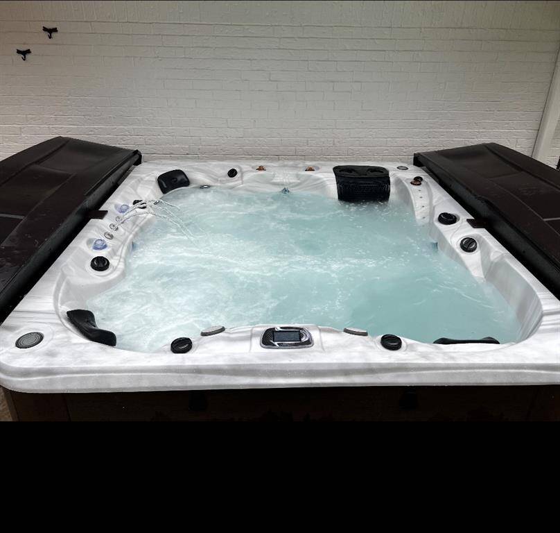 Hot Tub Located at the Back of the Main House