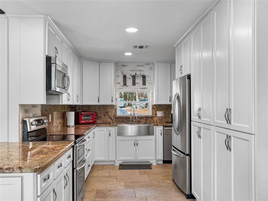 Main House Kitchen with Stainless Appliances and Lots of Counter top Space