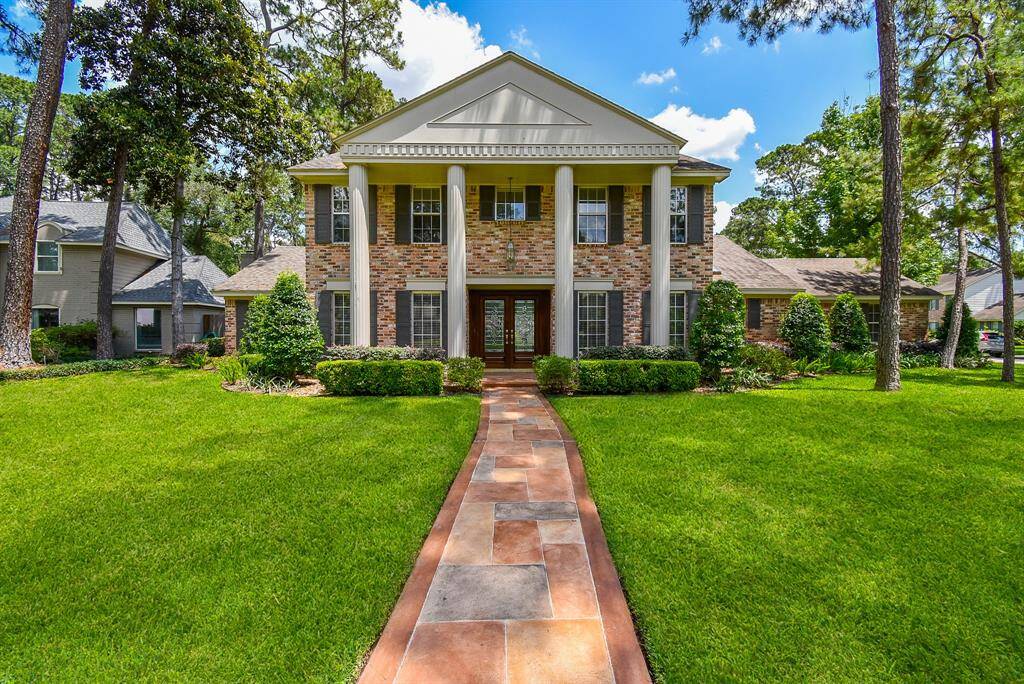 This stately 2-story brick treasure occupies a desirable corner lot at 13602 Wendelyn Lane, Houston, TX, in the peaceful Huntwick Forest community.