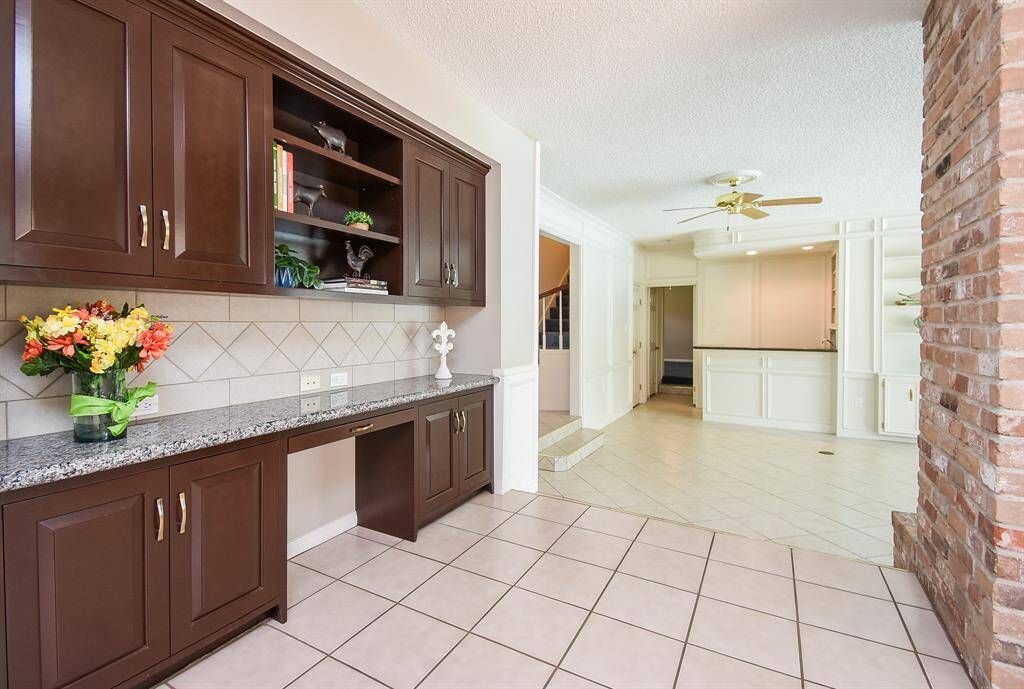 Updated? kitchen cabinetry is a winning feature in this sizeable kitchen, with counter/desk space and storage, above.