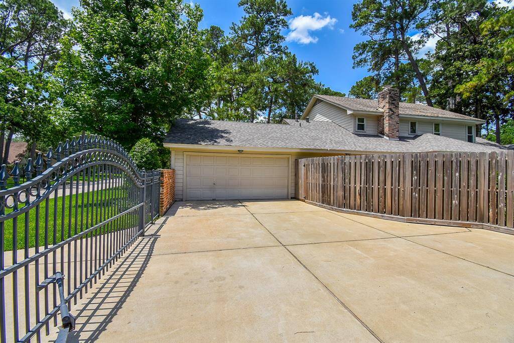 Privacy fencing (right) and a gated driveway ensure privacy and security.