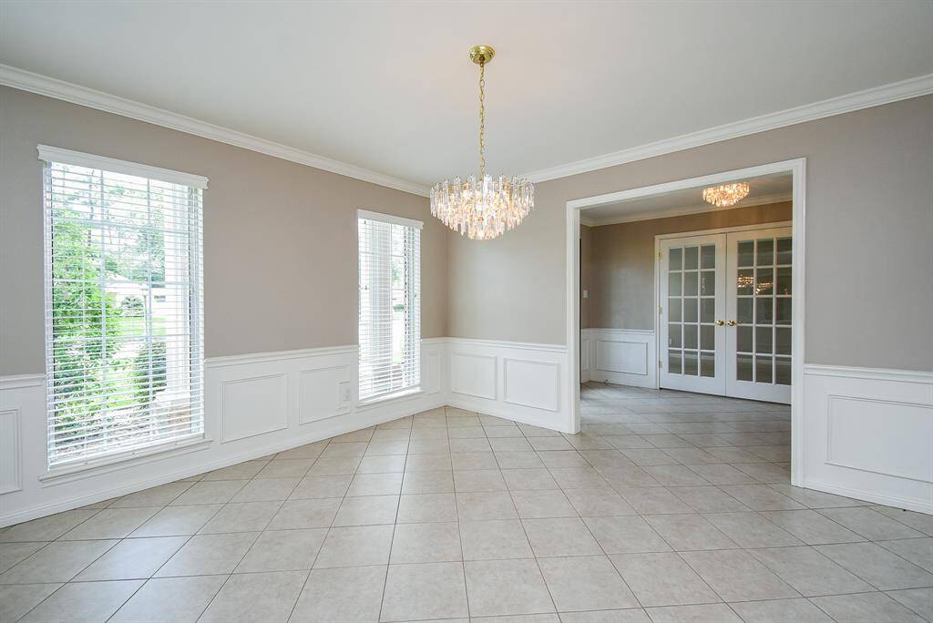 Here, you have a chance to 'virtually' place your dining treasures in this bright space; just across the main hallway from classic french doors, which enclose a potential home office.