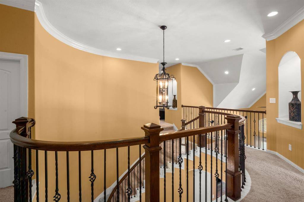 Gorgeous grand staircase view from upstairs.