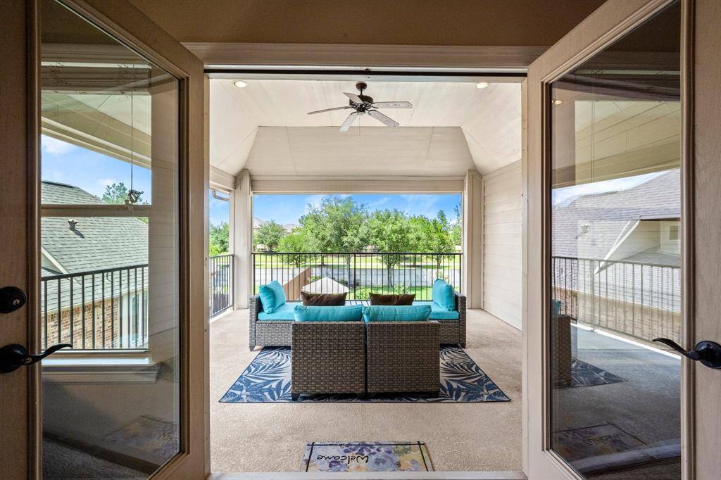 Balcony access with sweeping views of the backyard.