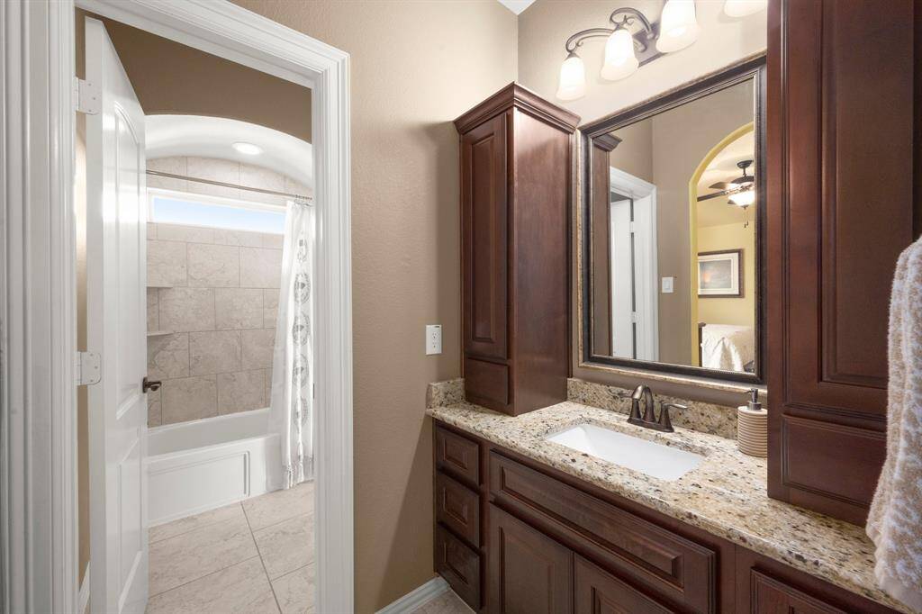 Jack-and-Jill bath connects two rooms for easy living.