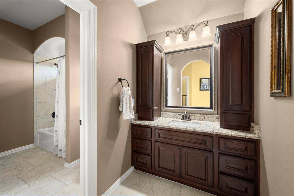 Jack-and-Jill bath connects two rooms for easy living.