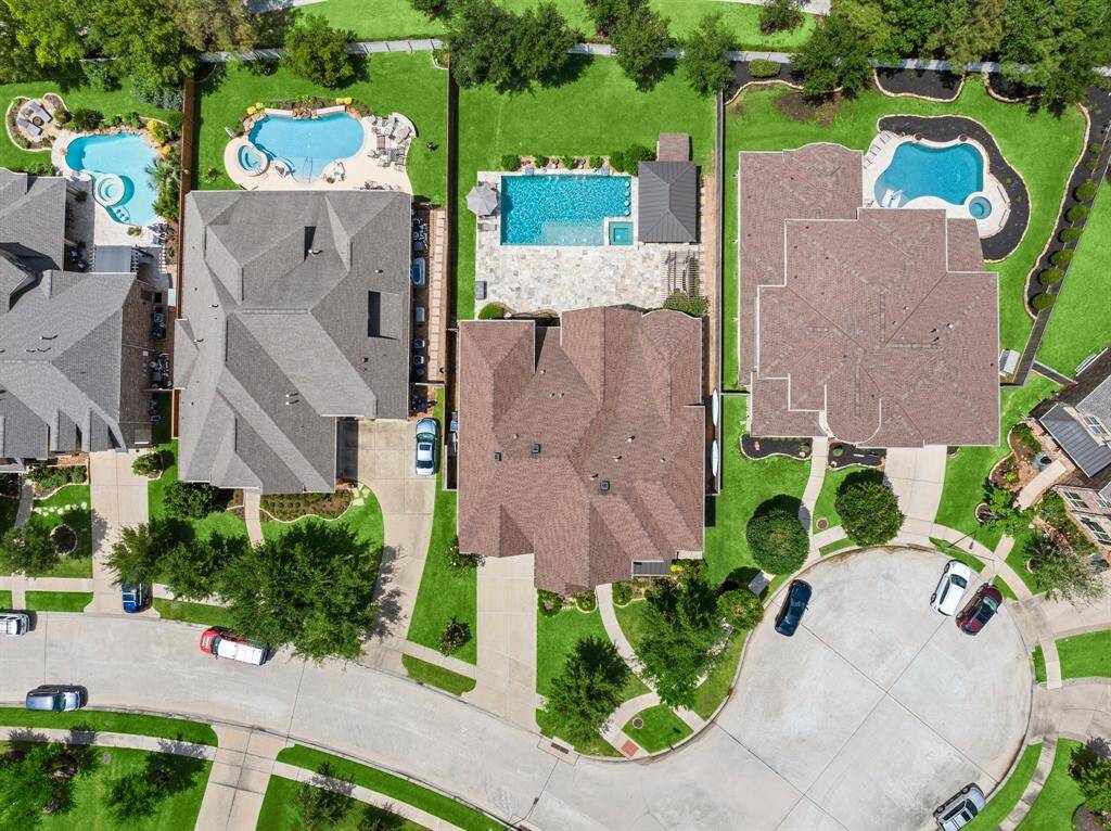 Whether hosting a summer pool party or cozying up by the firepit, this backyard is made for year-round enjoyment.
