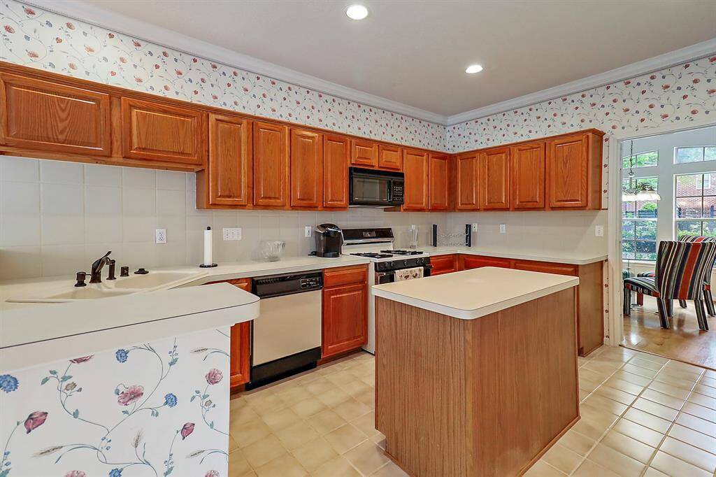Spacious kitchen with ample counter space and natural light.