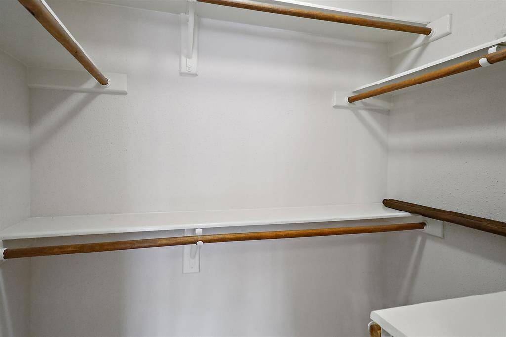 Expansive walk-in closet with ample storage space.