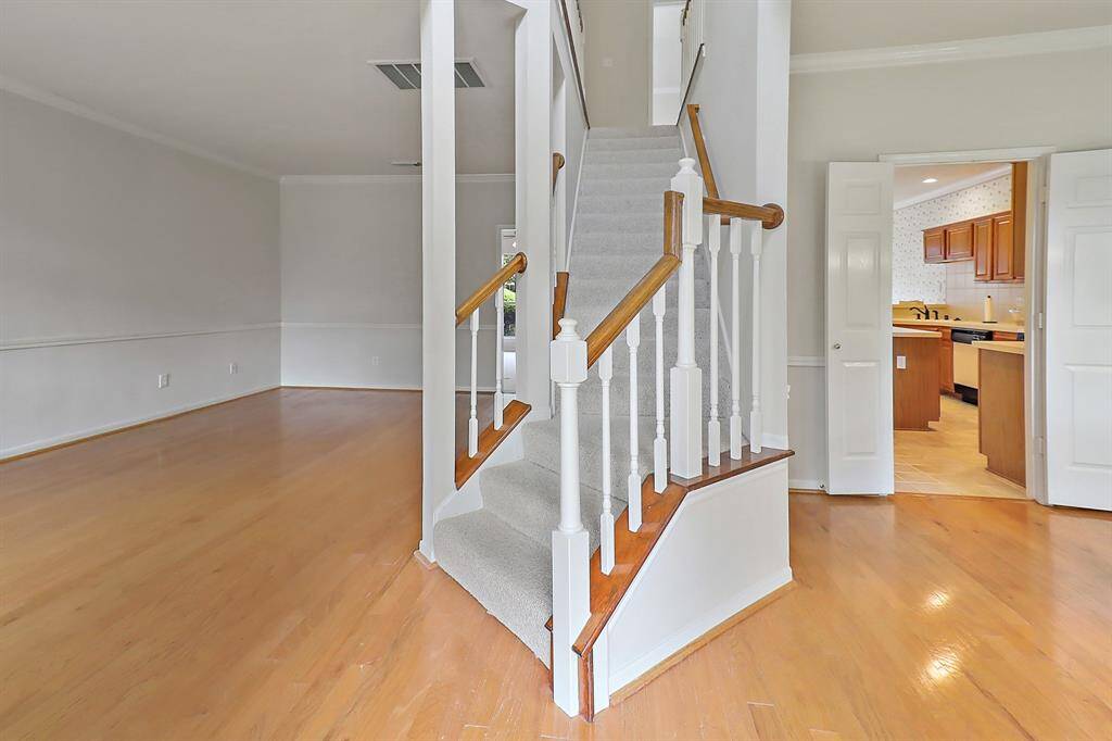 Upon entry, the living room welcomes you on the left, while the dining room invites you on the right.