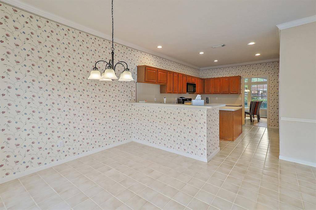 Cozy breakfast nook with a view into the inviting kitchen.