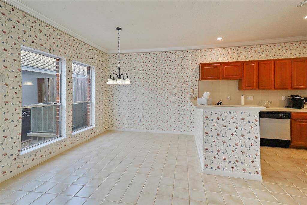 Charming breakfast nook with abundant natural light and cozy ambiance, perfect for morning gatherings.