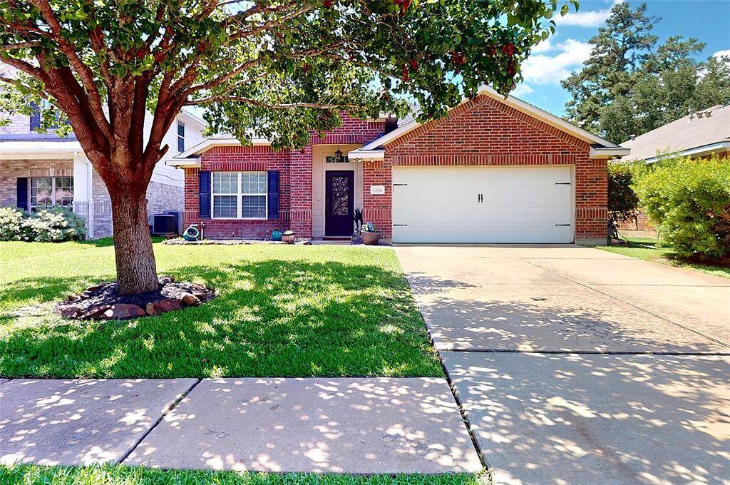 Spacious driveway provides ample parking and easy access.