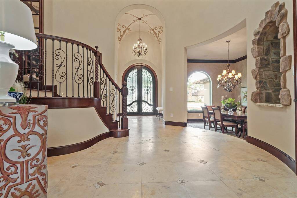 Upon entering, you'll find an expansive open-concept layout, with a Formal Dining room near the entry and soaring ceilings that enhance the sense of space and grandeur.