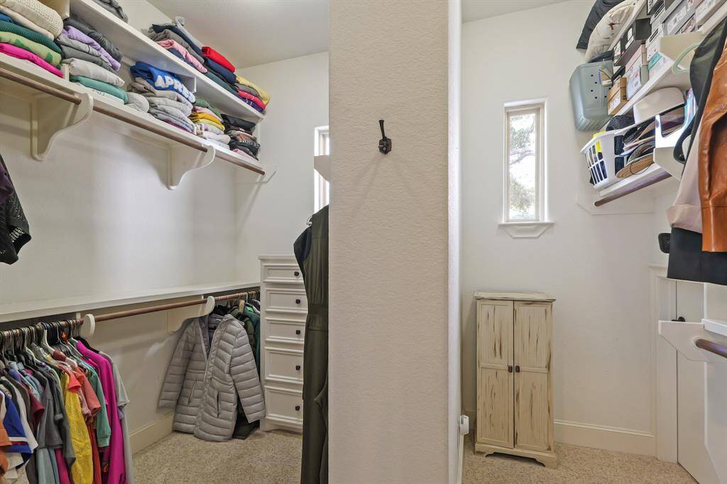 With plenty of space to move around, the Primary Walk-In Closet offers a practical storage experience.