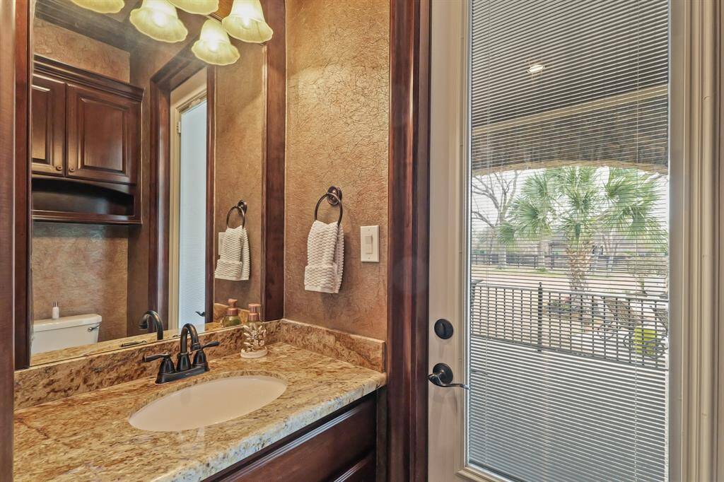 Lovely guest Bathroom opens directly to the backyard retreat, providing easy access to outdoor relaxation areas.