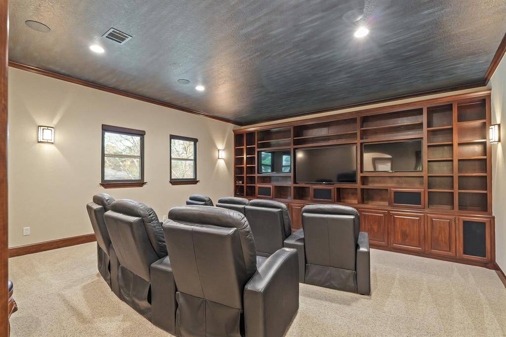 The Media Room offers a cozy yet functional space, with custom built-ins that provide both stylish storage and a polished look, making it the ideal environment for immersive entertainment.