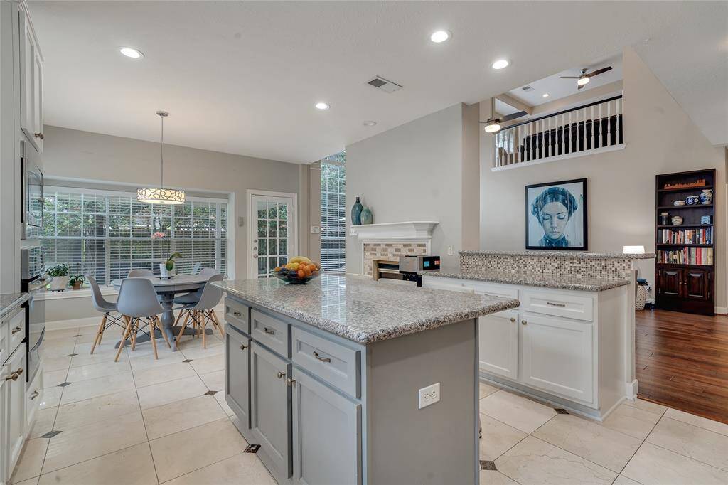 An abundance of storage space in the kitchen and a walk-in pantry. There is also a laundry room with a washer and dryer.