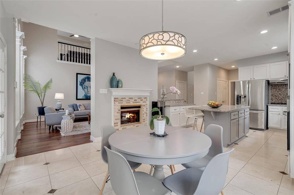 The spacious breakfast area has a cozy double-sided fireplace.