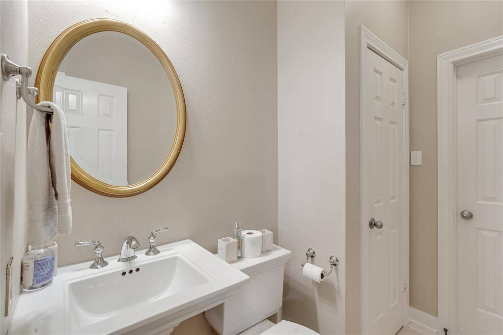 A view of the powder room, which can be accessed from the study and the living room.